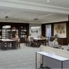 Interior rendering of an Erickson Senior Living community dining and bar area with tables, lounge seating, and a television.